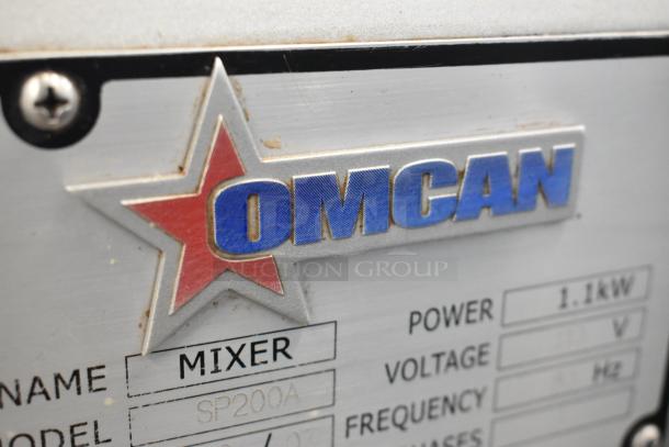 2019 Omcan SP200A metal mixer closeup with brand logo and model details, showing manufacturer's label in good condition.