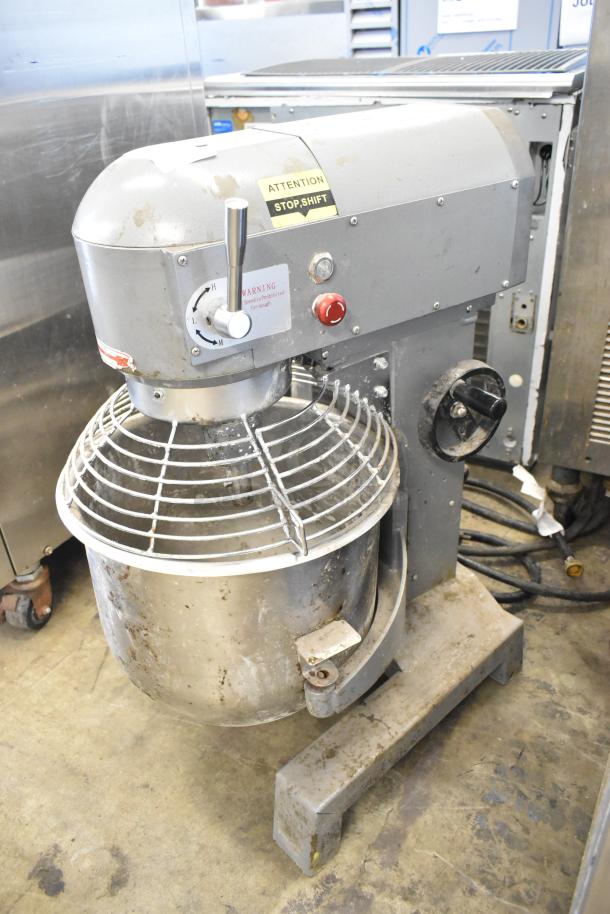 Metal commercial 20-quart planetary dough mixer with stainless steel bowl, bowl guard, and dough hook. 115V, 1 phase. Used condition.