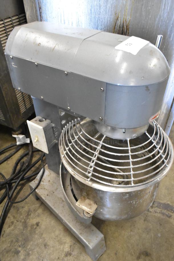 Metal commercial 20-quart planetary dough mixer with stainless steel bowl, bowl guard, and dough hook. 115 volts, 1 phase.