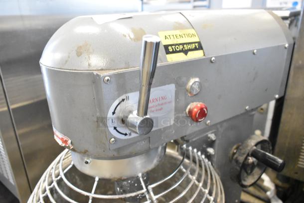 Commercial 20 Qt. planetary dough mixer with stainless steel bowl, bowl guard, and dough hook attachment. 115V, 1 phase.