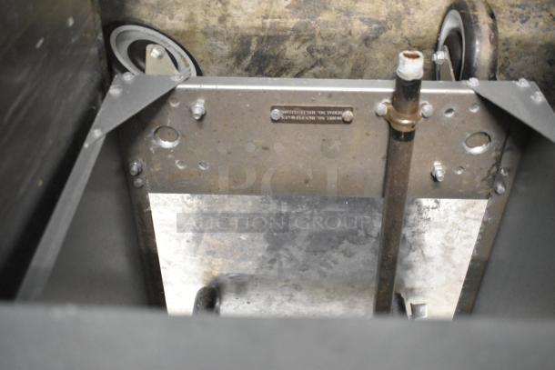 2024 Hurakan HKN-FXF40A/US stainless steel natural gas deep fat fryer on casters. Features 90,000 BTU, robust build.