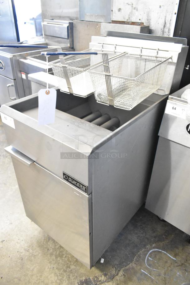 Dukers DCF5-NG stainless steel commercial deep fat fryer with 2 metal baskets, on casters, 150,000 BTU, natural gas powered.