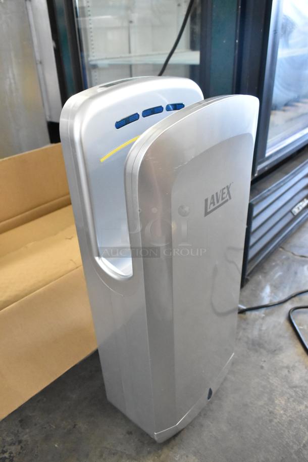 BRAND NEW KW-1091PLUS silver ABS plastic hand dryer, vertical design, HEPA filtration, 110/120V, minor scratches visible.