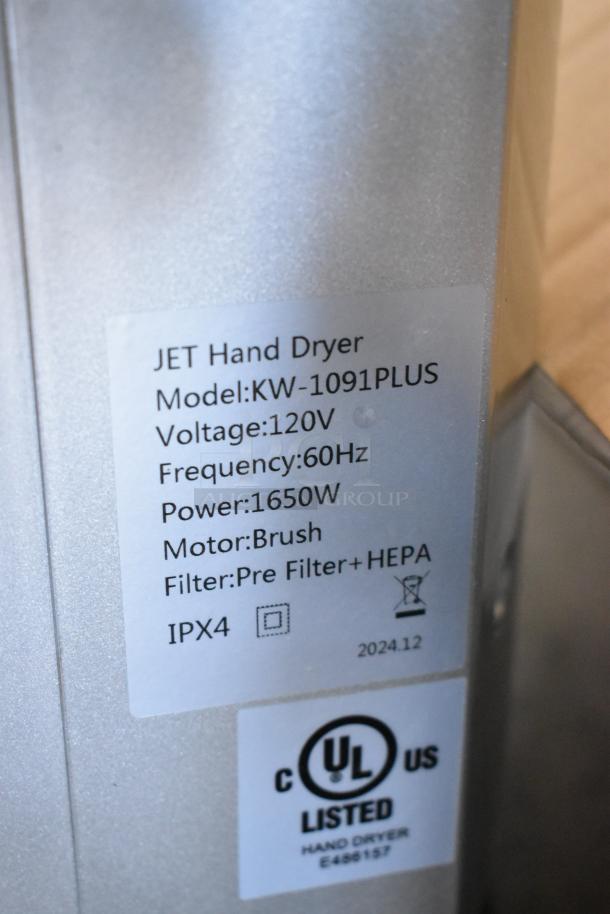 BRAND NEW SCRATCH AND DENT! KW-1091PLUS hand dryer, silver ABS plastic, HEPA filtration, 120V, UL listed. Model label visible.