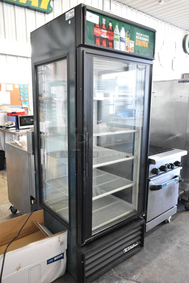 True GEM-26 metal single door reach-in cooler, poly coated racks, 115 volts, 1 phase, commercial use, glass front.
