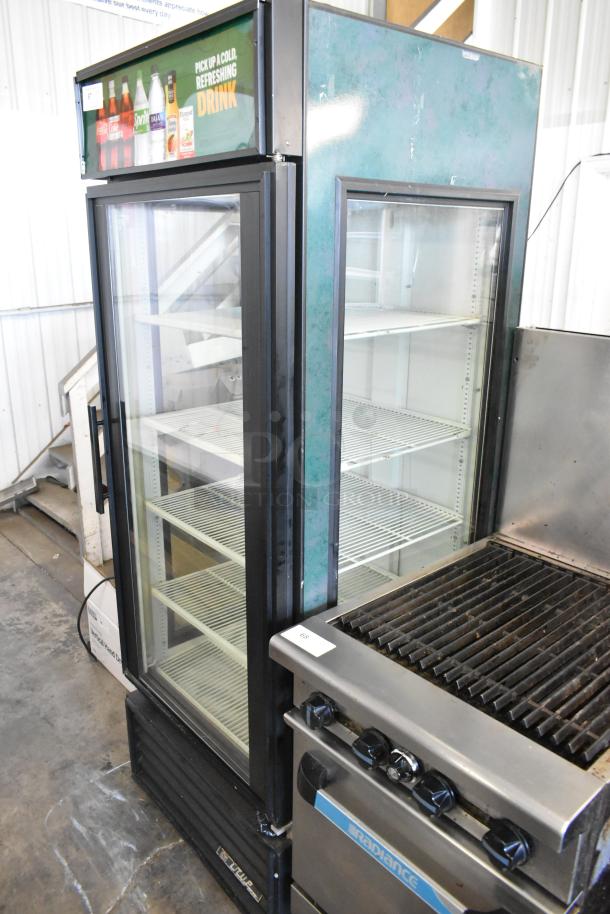 True GEM-26 commercial single door cooler, includes poly-coated racks, 115V, 1 phase. Exterior shows signs of wear.