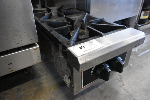 Toastmaster stainless steel commercial gas 2-burner range, shows signs of wear, auction tag 69 visible on control panel.