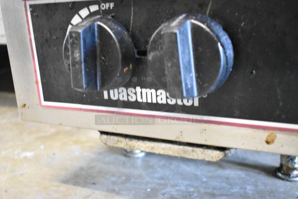 Toastmaster stainless steel commercial countertop gas 2 burner range with control knobs and branding visible, showing used condition.