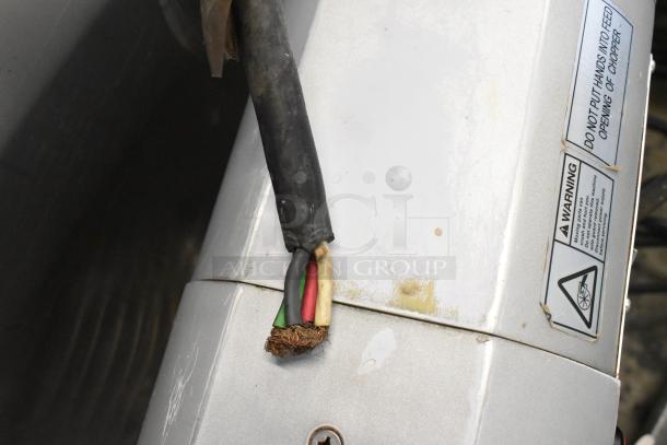 Damaged power cord on Electro Freeze 88TN-CMT-132 ice cream machine. Visible warning label, stainless steel panel.