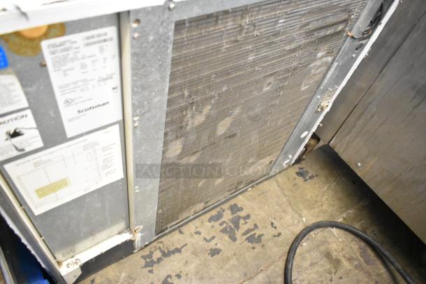 Scotsman C1030MA-32B stainless steel commercial ice head, 208/230 volts, 1 phase, visible wear, label details included.