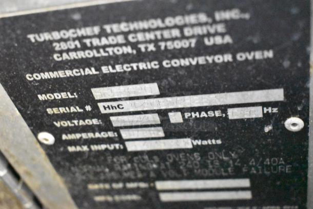 Close-up of Turbochef HhC2020 conveyor oven label showing model, serial number, voltage, and phase specifications.