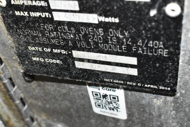 Close-up of the label on a 2017 Turbochef HhC2020 commercial conveyor oven, listing specifications and manufacturing info, slightly worn.