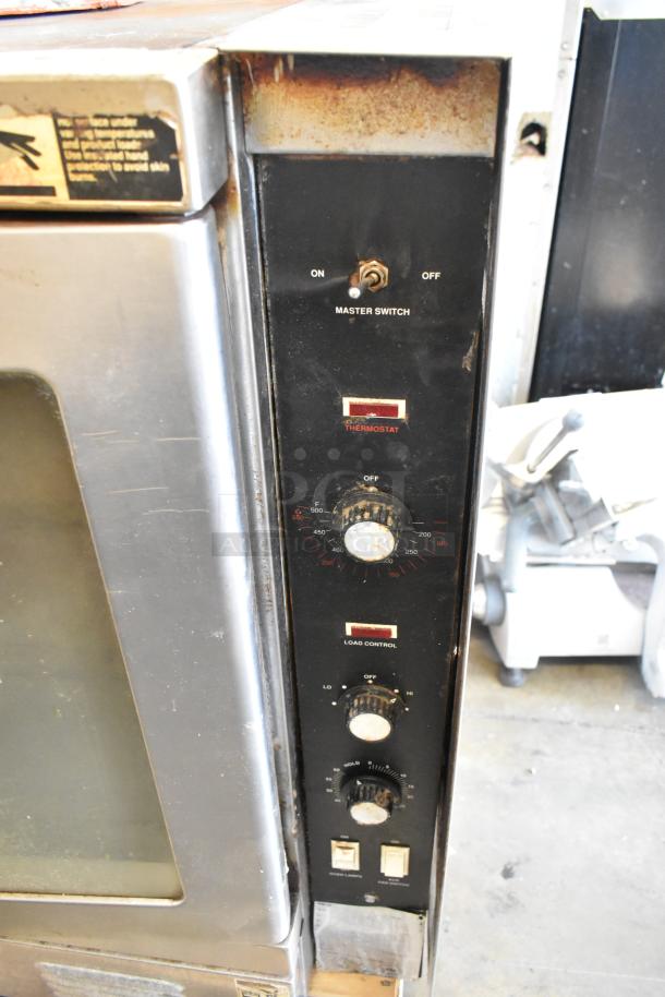 Vulcan SG1010T stainless steel commercial convection oven with view-through doors, metal racks, and thermostatic controls. 70,000 BTU.