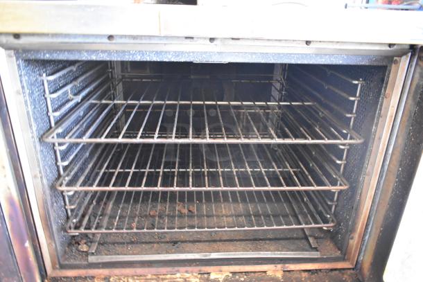 Vulcan SG1010T stainless steel convection oven, natural gas, view-through doors, metal racks, thermostatic controls.