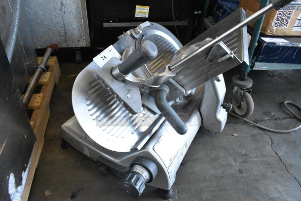 Hobart 2812 stainless steel commercial meat slicer, 115 volts, 1 phase, in used condition with minor wear.