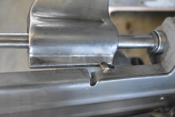 Hobart 2812 stainless steel meat slicer, commercial use, 115 volts, 1 phase, visible wear on housing.
