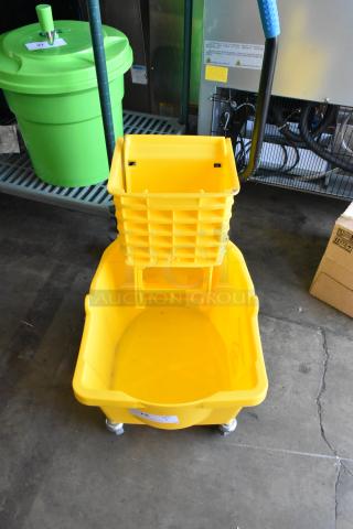 Yellow poly mop bucket with wringing attachment, on casters. Includes visible label. Ideal for commercial cleaning.