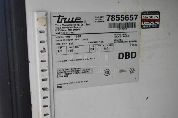 True TWT-60F stainless steel commercial 2-door worktop freezer label showing specs: 115 volts, 1 phase, on casters. Made in USA.