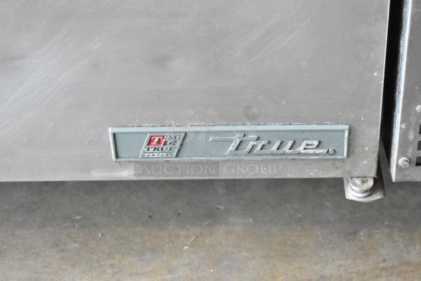 2017 True TPP-67 stainless steel pizza prep table with logo, on commercial casters, 115 volts, 1 phase.
