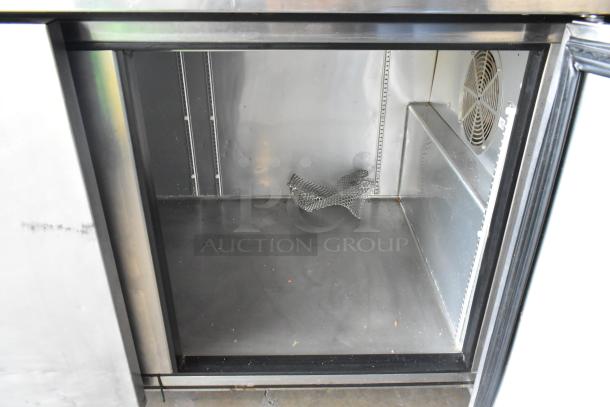 2017 True TPP-67 stainless steel pizza prep table, commercial casters, interior view, 115V, 1 Phase.