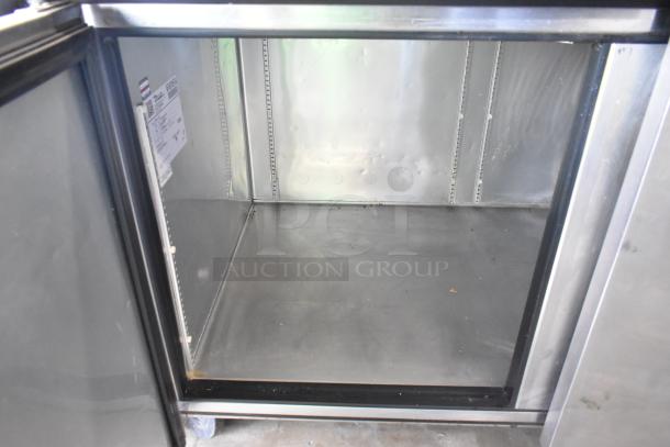 2017 True TPP-67 stainless steel pizza prep table with casters, 115V, 1-phase. Interior view, clean condition.