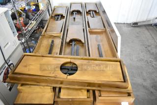 8 brand new scratch and dent wooden folding tables, natural finish, visible support structure, ready for assembly.