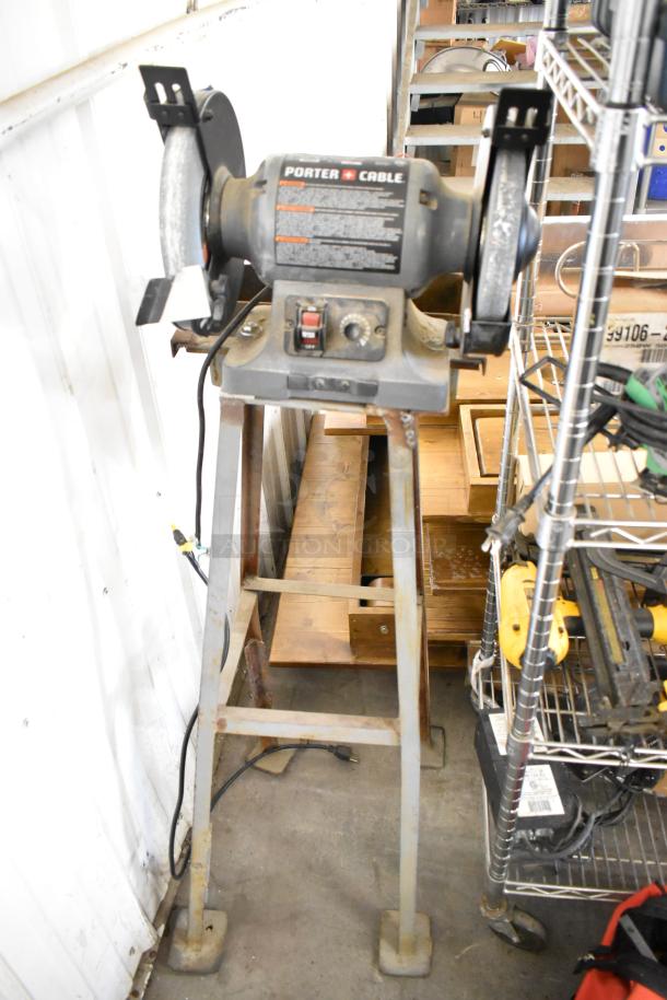 Porter Cable PCB575BG bench grinder on metal stand, 120 volts, 1 phase, good condition, visible control panel.