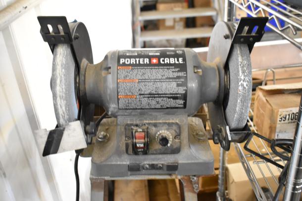 Porter Cable PCB575BG bench grinder, 120V, 1 phase; gray with dual grinding wheels, visible on/off switch.