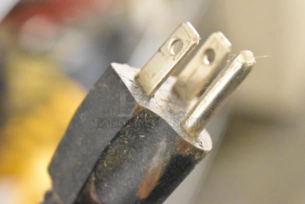 Power plug of Porter Cable PCB575BG Bench Grinder, 120 Volts, 1 Phase, close-up view.