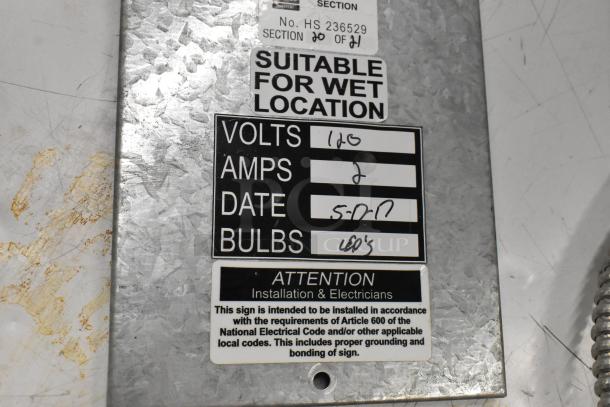 Metal power supply box, suitable for wet locations, 120 volts, 2 amps, LED bulbs. Markings emphasize installation standards.