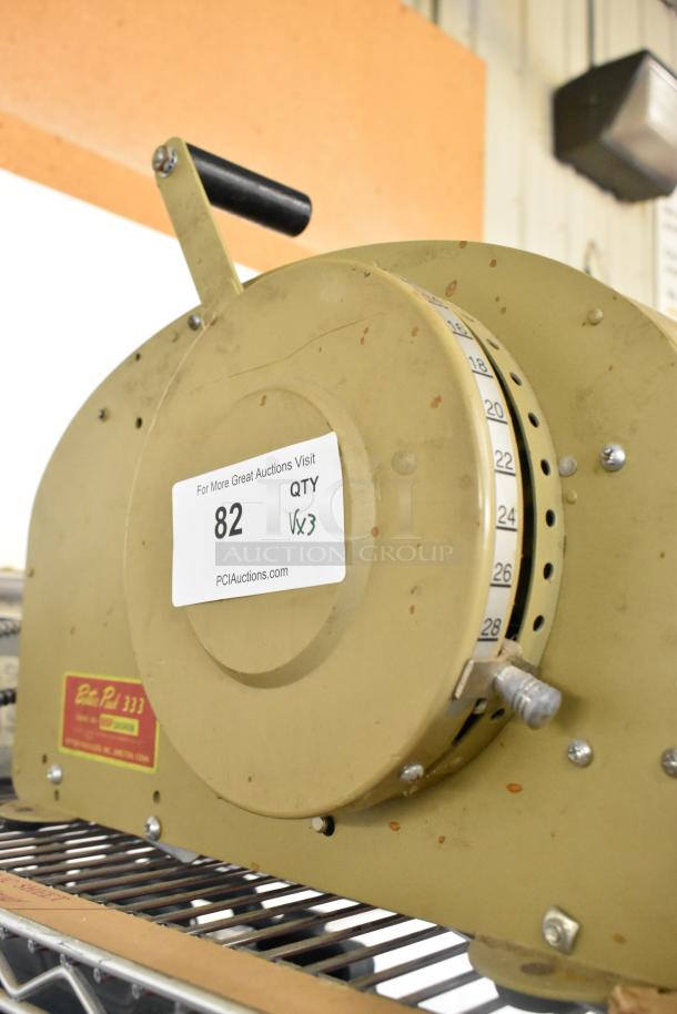 Vintage Better Pack 333 label dispenser in fair condition, with manual crank and measurement dial. Auction tag indicates lot 82.