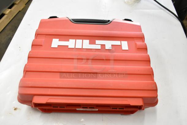 Red Hilti tool box with black handle, featuring the Hilti logo. Rugged design with secure latches.