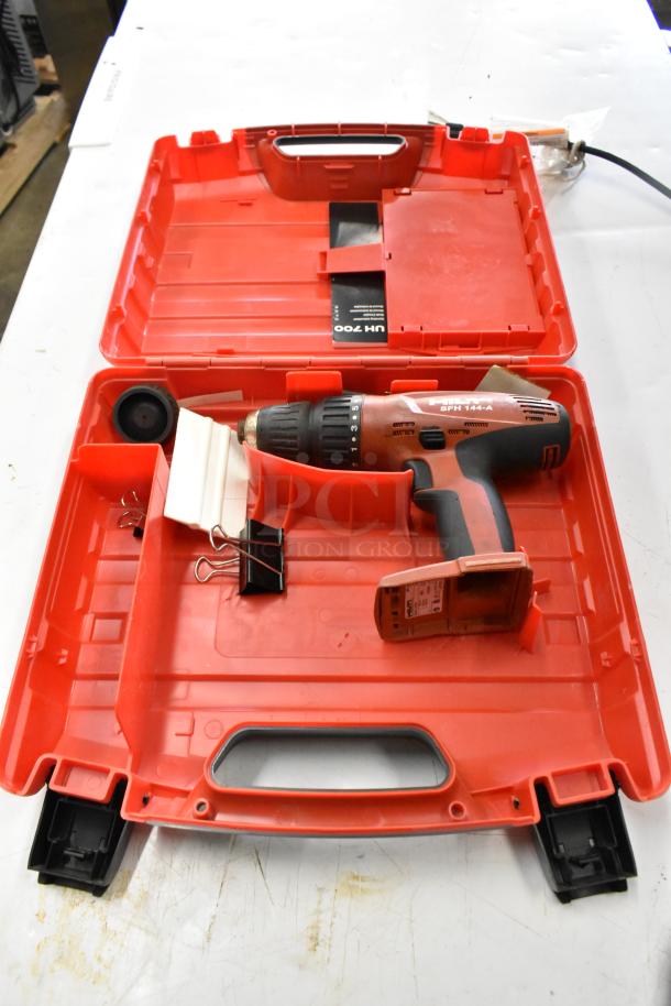 Hilti SFH144-A drill in red tool box, slightly used, includes accessories.