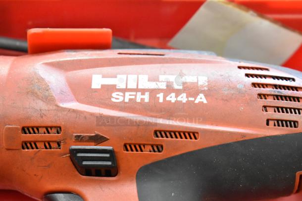 Hilti SFH144-A drill body close-up with visible scratches, logo, and controls. Part of a lot with tools like Bosch and DeWalt saws.