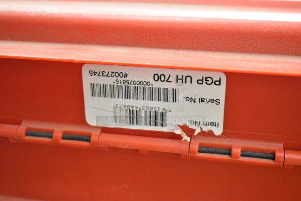 Red Hilti tool box with visible label showing item and serial numbers. Includes various tools like drills and saws.
