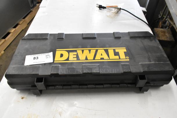 Black DeWalt tool case with label indicating auction lot number 83.