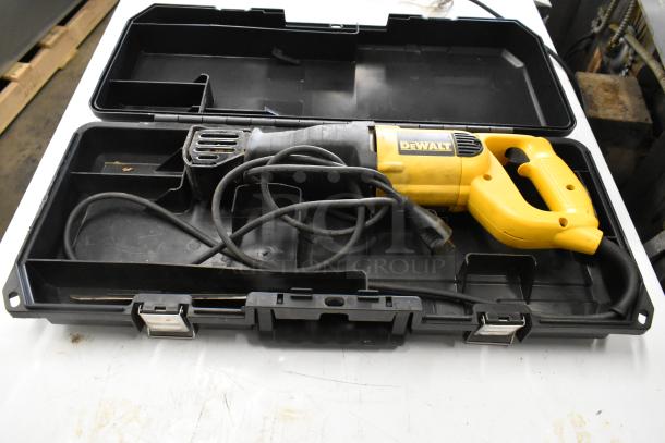 DeWalt DW304P reciprocating saw in black hard case with visible cord and yellow handle, in used condition.