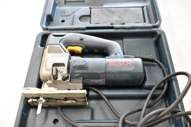 Bosch jigsaw in a case, shown with visible branding. Part of a lot with Hilti, DeWalt, and Skil tools.