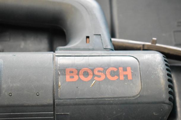 Bosch tool with visible logo, part of an auction lot including various tools like Hilti drill, DeWalt saw, and more.