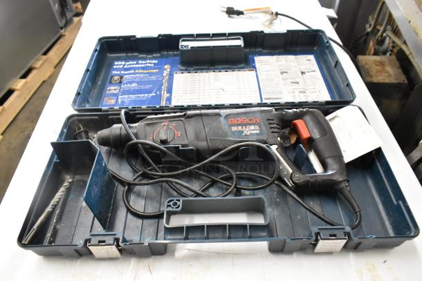 Bosch 11255VSR Bulldog Xtreme Rotary Hammer in carrying case, includes drill bit, used condition, visible model label.