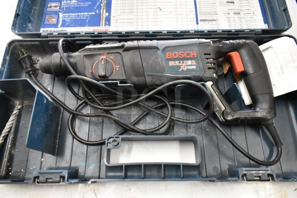 Bosch 11255VSR Bulldog Xtreme Rotary Hammer in open tool case, pre-owned, visible cable, and control settings.
