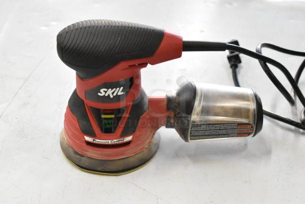 Skil 7492 Grinder with Pressure Control, red and black, in good condition. Dust collector attached, cord included.