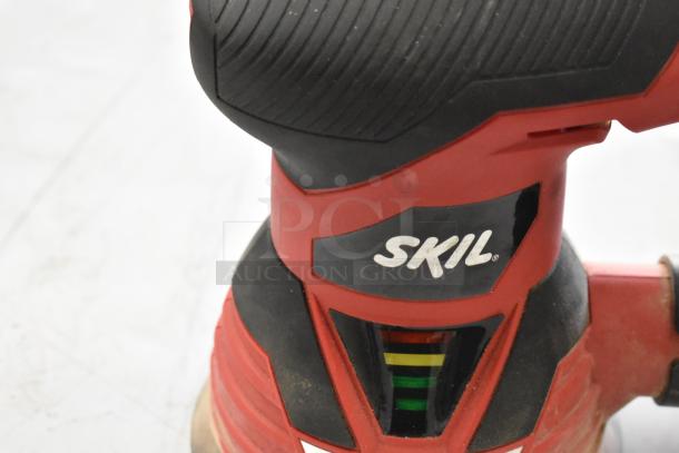 Skil 7492 Grinder detail, featuring black and red design, visible Skil logo, worn condition, part of 7-item tool auction.