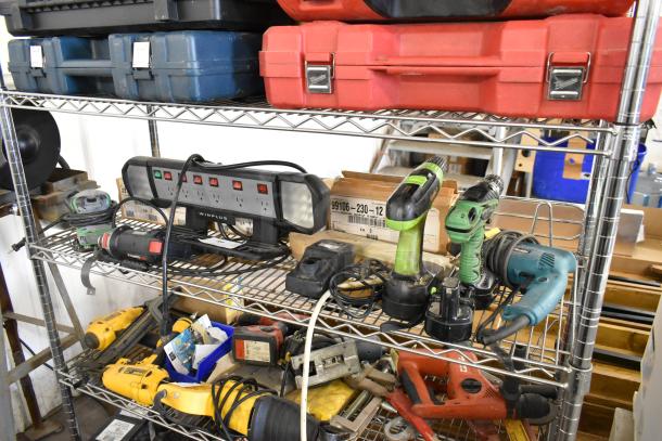 Auction items on metal shelves include Roto Zip DR1, Hitachi SV12SG Sander, Hitachi DS12DVF3 Drill, Winplus Power Station, and more.