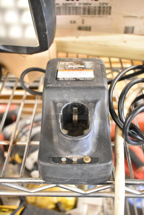 Roto Zip DR1 tool on metal shelf, showing wear. Includes Hitachi SV12SG, DS12DVF3, Winplus Power Station with LED work lights.