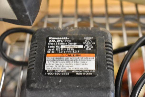 Kawasaki 19.2V battery charger, model 690507, with input 120V 60Hz, output 19.2V 1.3A, in used condition.