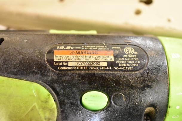 Warning label on a power tool showing 19.2V, serial number 6070033090, and made by Alltrade Tools LLC, UL certified.