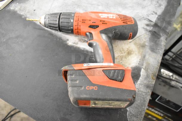 Hilti SFH 18-A cordless drill in used condition with visible CPC marking, resting on a workbench.