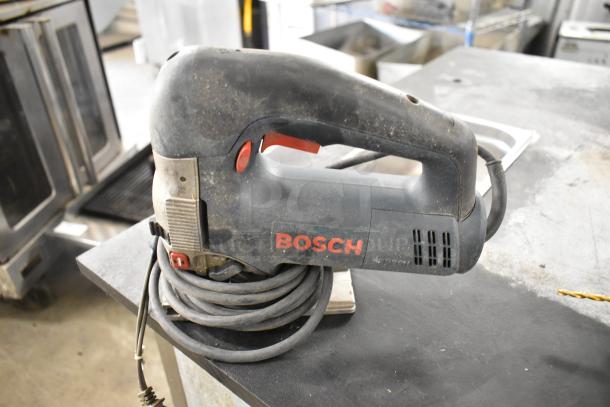 Bosch 1590EVS Sander in used condition, featuring a corded design and visible dirt marks, displaying the Bosch logo.