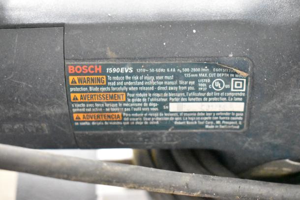 Bosch 1590EVS sander label with warning details. Max cut depth 135mm, 500-2800/min. Includes other tools: DeWalt saw, stapler, Hilti TE4-A18.
